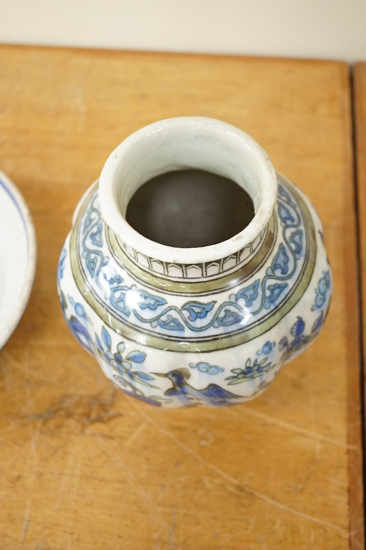A Persian bird painted fritware lobed vase, 19.5cm high and a similar bowl, Qajar dynasty (2)